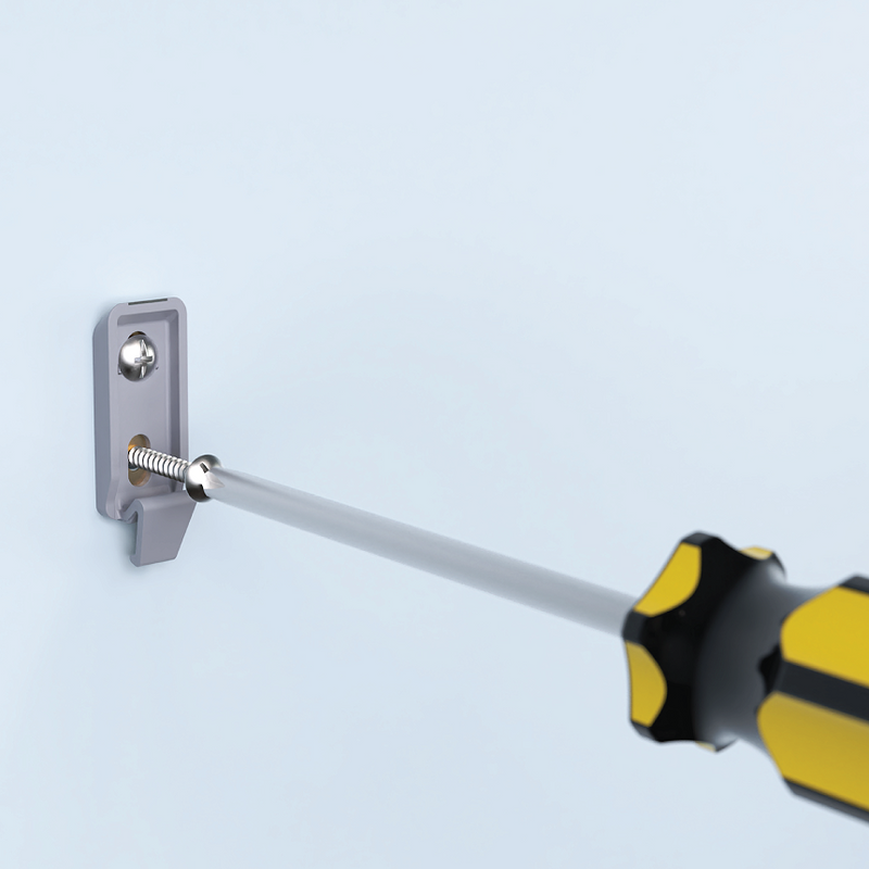 Screwdriver with a yellow handle attached to a metallic bracket on a light blue background